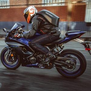 Black Cortech motorcycle commuter backpack with expandable storage and laptop sleeve for daily riders.