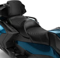 Black two-up seat shown installed on a blue Can-Am Spyder RT. It features textured center panels, detailed stitching, and raised support between the rider and passenger areas.