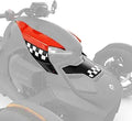 Glossy red upper accent panels paired with black lower sections and bold black-and-white checkered racing graphics across the front bodywork.