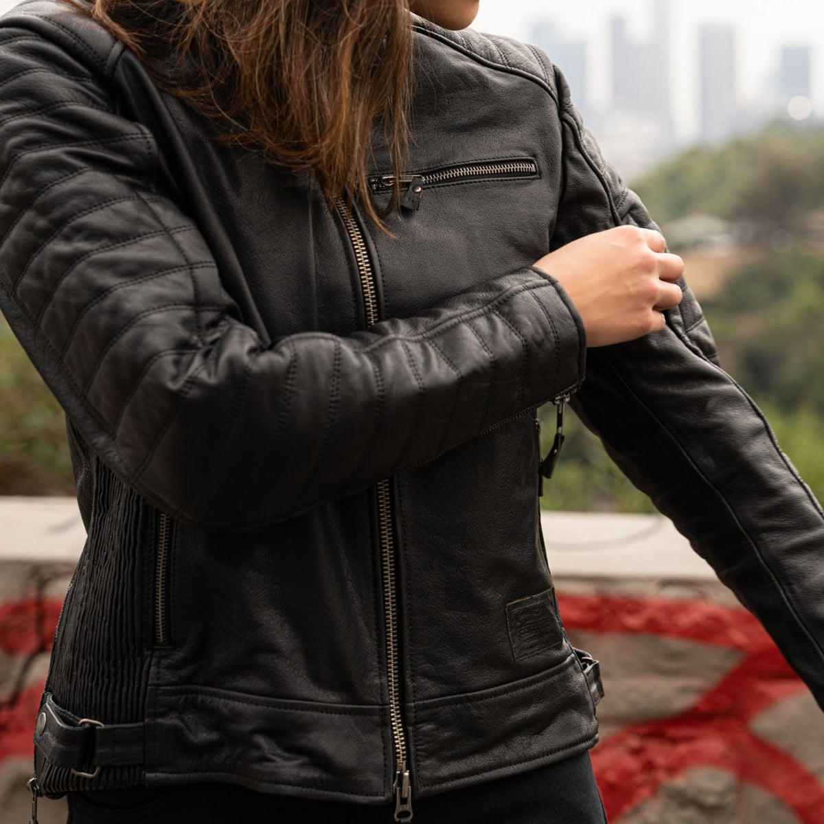 Cortech women’s leather moto jacket with zippered pockets and classic motorcycle styling for everyday riding.