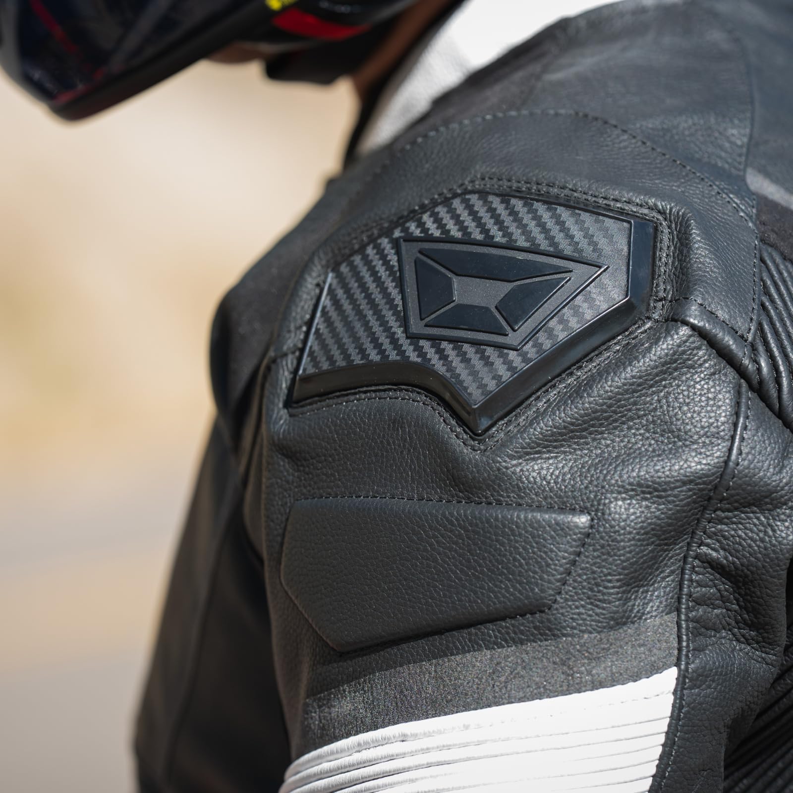 Black Cortech leather riding jacket with stretch panels and shoulder sliders designed for performance motorcycle riding.