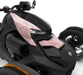 Light pink accent panels installed across the upper front bodywork, decorated with fine black leaf and floral line patterns against the vehicle’s matte-black finish.
