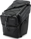 Large black Can-Am storage bag with multiple zippered compartments, adjustable mounting straps, side pockets, carrying handles, and elastic retention cords across the top.