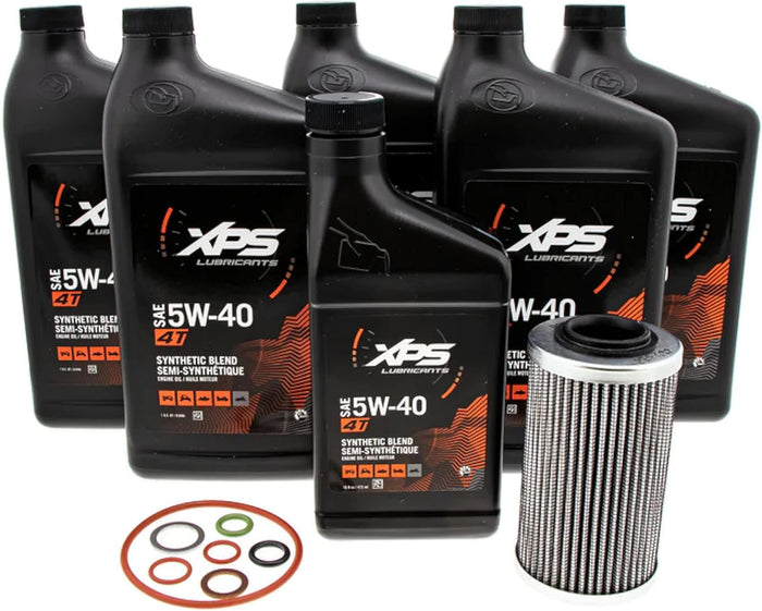 Six black bottles of XPS SAE 5W-40 4T oil, one cylindrical oil filter, and assorted replacement O-rings. The bottles shown are labeled “Synthetic Blend,” not full synthetic, so the listing title and product should be verified before publishing.