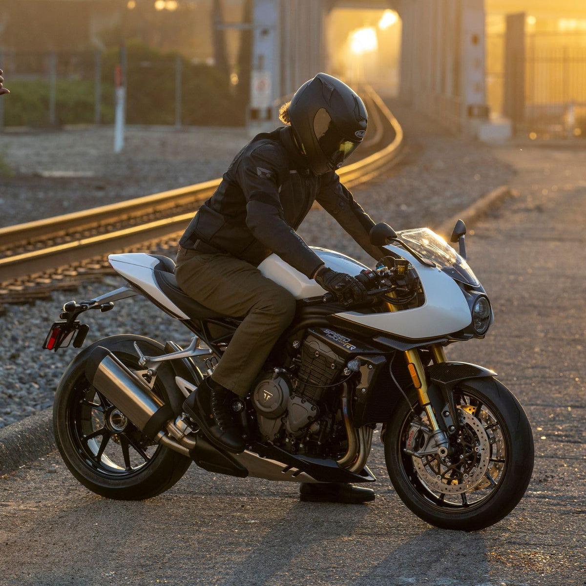 Black camo Cortech leather mesh motorcycle riding jacket with ventilation panels and removable liners for street and touring riders.