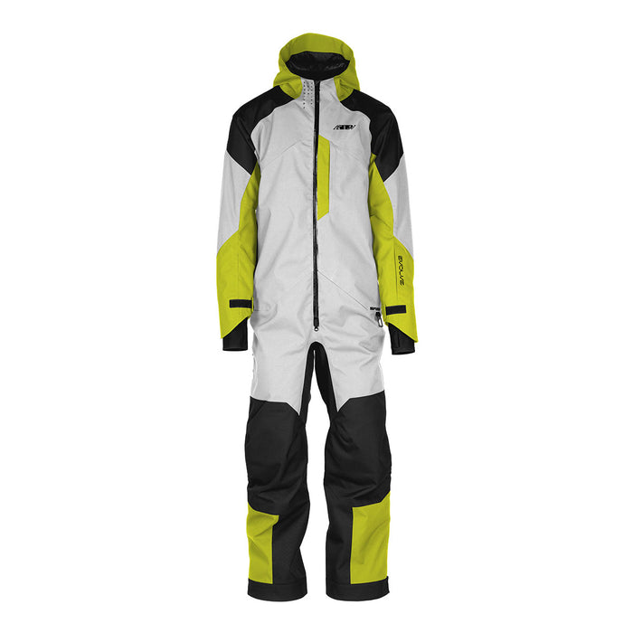 A full-body shot of a rider in the 509 Evolve Monosuit Shell Highlander side-hilling a snowmobile in a deep powder backcountry setting. (Focus: Action, Backcountry, Monosuit)